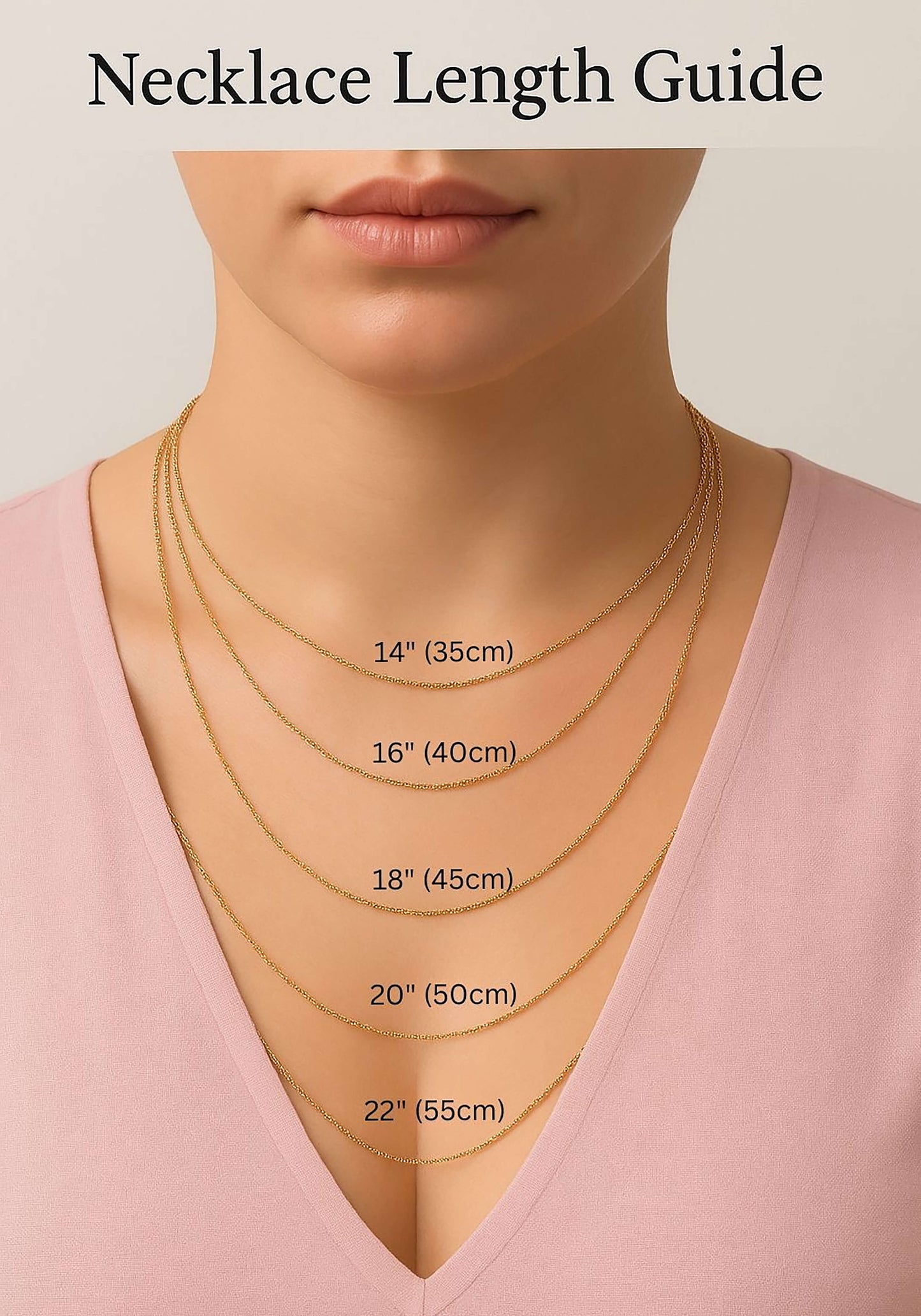 Necklace length guide showing gold chains in 14 inch (35cm) to 22 inch (55cm) lengths on a woman wearing a pink V-neck top. Helpful visual for choosing the perfect necklace fit for layering or individual wear.