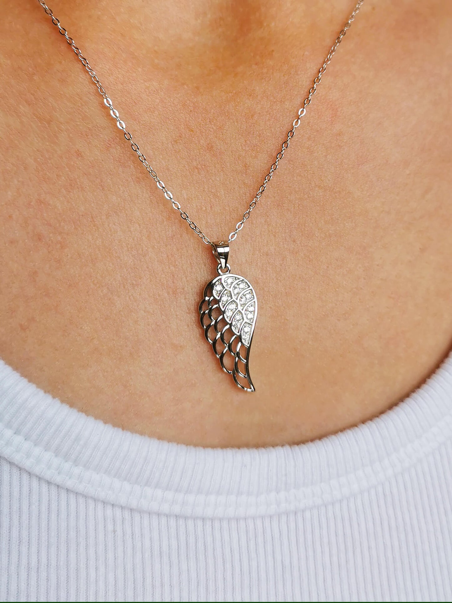 Wings of Grace – Sterling Silver Angel Wing Pendant with Cubic Zirconia
