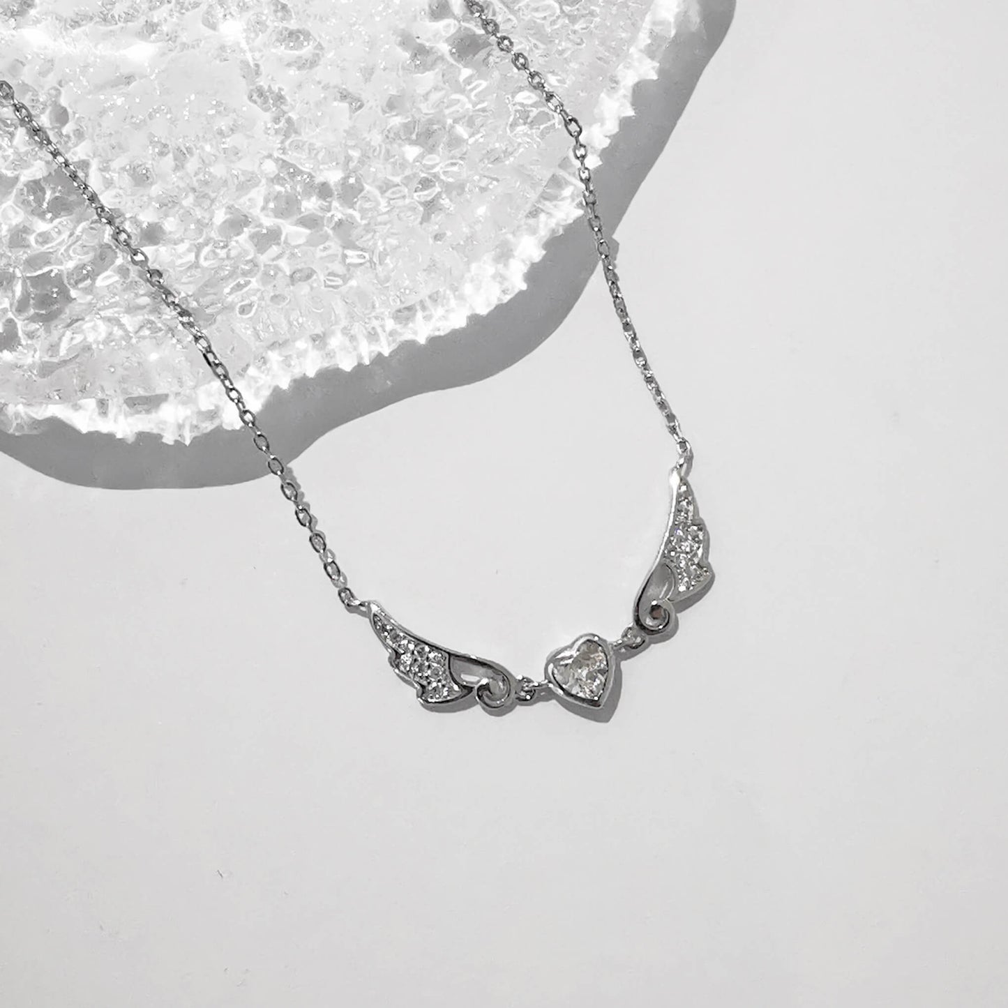 Sterling silver angel wing necklace pendant with central zirconia heart. Beautifully presented and comes gift boxed with quote insert.
