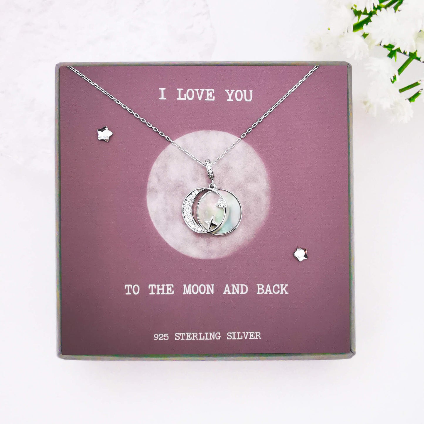 925 sterling silver double pendant necklace featuring crescent moon and star on a stunning white shell back.  This unique gift is gift boxed and presented on a hand made and hand embellished insert with the quote: "I love you to the moon and back".  The perfect unique gift for anniversary, valentines, birthday or Christmas.