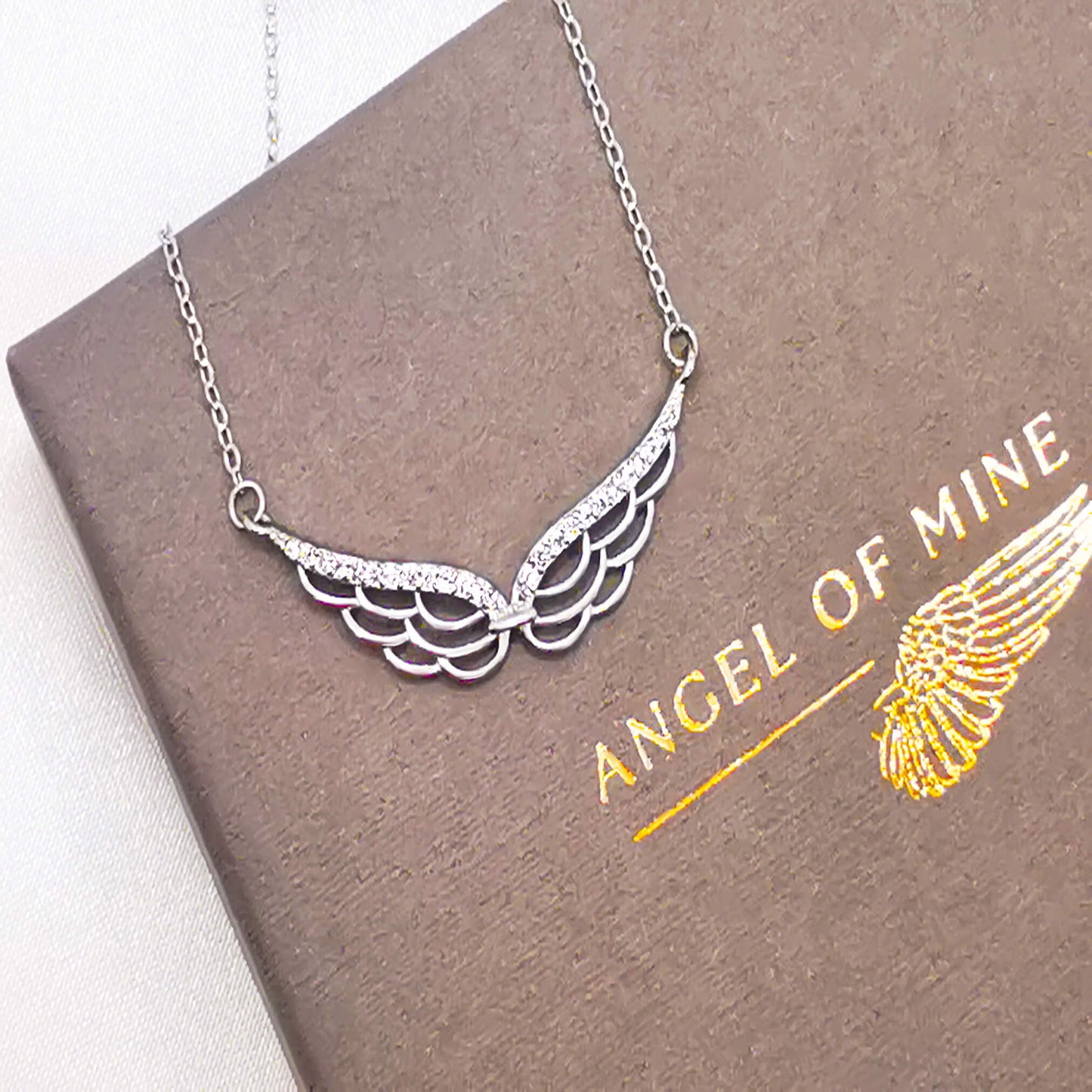 stunning sterling silver double wing necklace with micro zirconia.  Detailed angel wing.